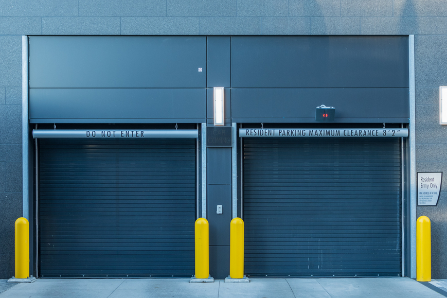 Two blue Rool-Up doors installed on the loading dock of a commmercial building in Washington DC